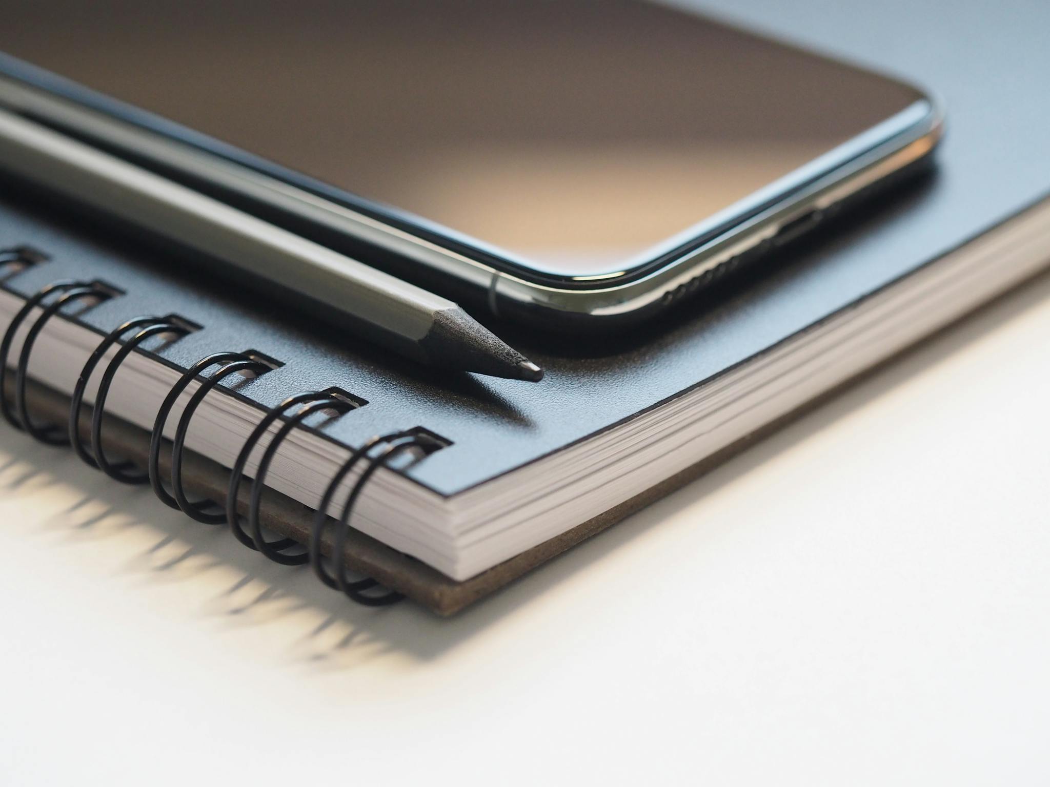 closeup photo of black smartphone near black